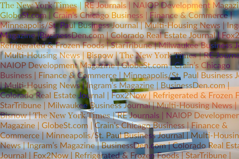 names of media outlets listed in foreground with a table and chair in the background